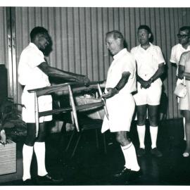 Staff - Social Functions - Branches - Port Moresby - Farewell function for retiring Governor Dr 'Nugget' Coombs - Dr Coombs being presented with a coffee table - 27 June 1968