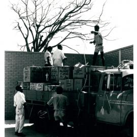 The Bank at Work - Branches - Port Moresby - Douglas Street - Exterior - Moving Day - Unloading the first lot of stationery in rear carpark - 7 June 1969