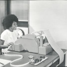 The Bank at Work - Branches - Port Moresby - Shows teleprinter operator in Communications Section - June 1969