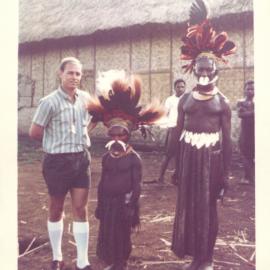 The Bank at Work - Branches - Commonwealth Bank of Australia - Port Moresby - Bill Robinson with two of the highlanders at Mt. Hagen - August 1963