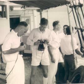 Bank's Functions - PNG Division - Savings & Loan Society - Father McGhee & Peter Ferguson aboard Mission Boat M.V. Morning Star bound for Samarai - 13 May 1962