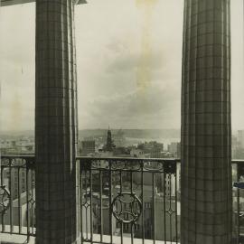 Premises - Government Savings Bank of NSW - Head Office 48-50 Martin Place - Exterior - Looking north-west through columns, Harbour Bridge construction in distance - 1928