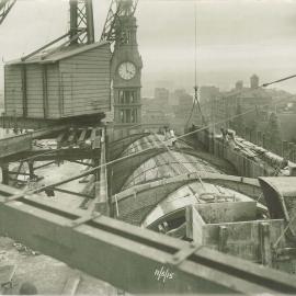 Commonwealth Bank - Head Office - Cnr Pitt Street & Martin Place - Construction - View of roof showing GPO clock-tower - 11 June 1915 (plate 701)