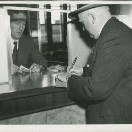 Hobart - Opening of new premises - Customer at counter - 27 September 1954