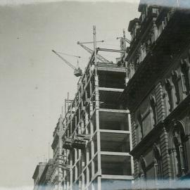 Head Office - Construction of new premises - Messrs. JP Gibson, J Jeffrey, HG Kirkpatrick and H Phippard ascending in bucket to view construction (copy e) - 11 March 1915