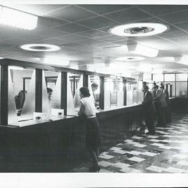 The Bank at Work - Branches - Hobart, 79-81 Liverpool Street - Tellers serving customers in the main Banking Chamber on opening day of the new branch - 27 September 1954
