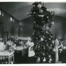 Staff - Head Office - Commonwealth Bank of Australia - Charity - Christmas tree donated by the Cot Fund Committee to the Upper Todman Surgical Ward, AK Ward as Santa Claus - December 1920