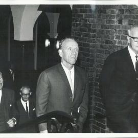 Dr Coombs, escorted by the Chancellor of the University of Western Australia, Sir Alex Reid, prior to the Governor delivering an address 'Training for Development' - 1963