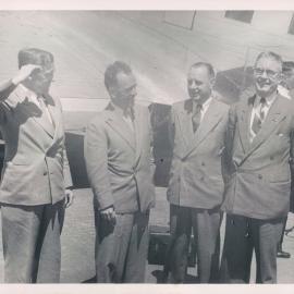 Staff Groups - Branches, Burnie/Devonport, Dr Roland Wilson, Dr HC Coombs, EB Richardson and HB Galwey, Bank's Plane - c.1950's