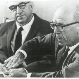 Coombs, HC and WH Wilcock explain detection of forged ten dollar notes, at a Press Conference - December 1966