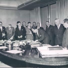 New Head Office Building - June 1960-January 1963 - Mr AC McPherson, Secretary, signs the contract on behalf of the Bank - 18 September 1961