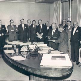 New Head Office Building - Coombs and EA Watts exchange contracts, L to R: Menzies, Andrew, Kinsey, Rowe, Scott, Gluckman, Matchett, Nolan, Tate, Calderwood, McGrouther, Phillips, McPherson - 19 September 1961