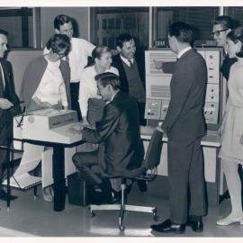 The Bank at Work - Head Office 65 Martin Place - Electronic Data Processing (EDP) Section gathered around an IBM 360/30 - 20 August 1968