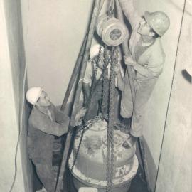 Adelaide Project - 1963-June 1967 - Installing ejector pump in area below 2nd basement - 14 April 1965
