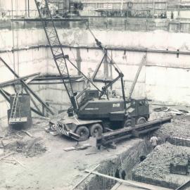 Adelaide Project - 1963-June 1967 - Base plate for column H4 being lowered into position - 5 August 1964