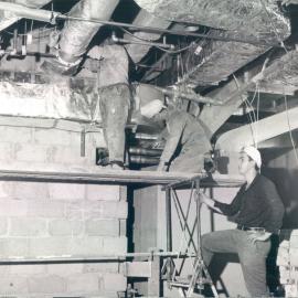 Melbourne Project - December 1961-September 1966 - Men working on installation of air-conditioning ducts on the 11th floor - 9 March 1966