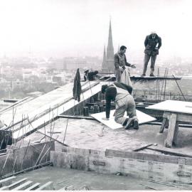 Melbourne Project - December 1961-September 1966 - North eastern corner of roof with St Patrick's Cathedral spire and Note Issue building in background - 13 July 1965