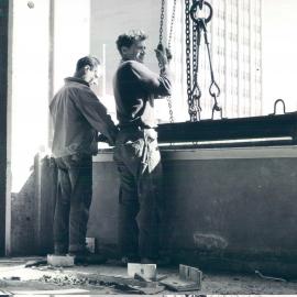 Melbourne Project - December 1961-September 1966 - Granite spandrel panel being hauled into position on western face of 2nd floor - 19 March 1965