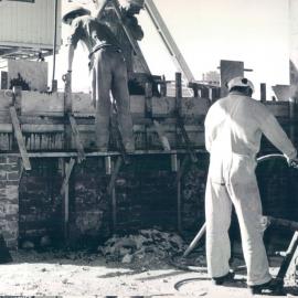 Melbourne Project - December 1961-September 1966 - Pouring of concrete for continuation of northern wall above height of adjoining building - 19 March 1965