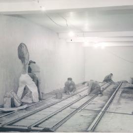 Melbourne Project - December 1961-September 1966 - Tracking being laid in strongroom No. 2, 3rd basement, for compactus installation - 17 August 1964