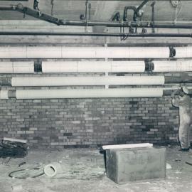 Head Office Building - January 1963-January 1965 - Covering hot water pipes with fibre glass insulation, 2nd floor - 5 July 1963
