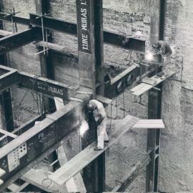 New Head Office Building - June 1960-January 1963 - Welders working on western side of lift wells at floor of 1st basement level - 4 January 1962