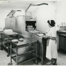 The Bank at Work - Head Office - Staff Recreation Area - Cafeteria (copy f) - Image of Mary (known as May) Frame loading dishwashing machine - c.1965