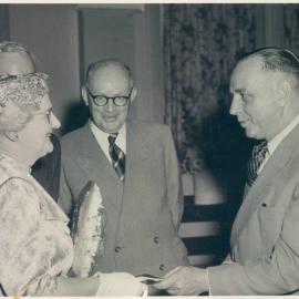 Staff - Social Functions - Head Office - Ivy Litchfield's farewell, with Stan Bryson and EB Richardson - 17 December 1956