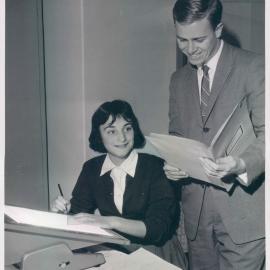 The Bank at Work - Head Office - Banking Department, Judy Symonds drawing graphs with Bill Robinson - 1960