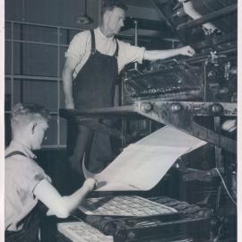 Note Printing Branch - Staff at work - Intaglio machine showing delivery of notes (view ii) Jack Kearney and Shamus O'Prey - 1960