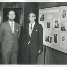 Vernon Lorimer, formerly of the Bank's staff, with HE Hayward, Archivist - Looking at a display by Archives on “The Art of Vernon Lorimer” - November 1971